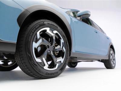 Blue car 3/4 profile with Kumho tires